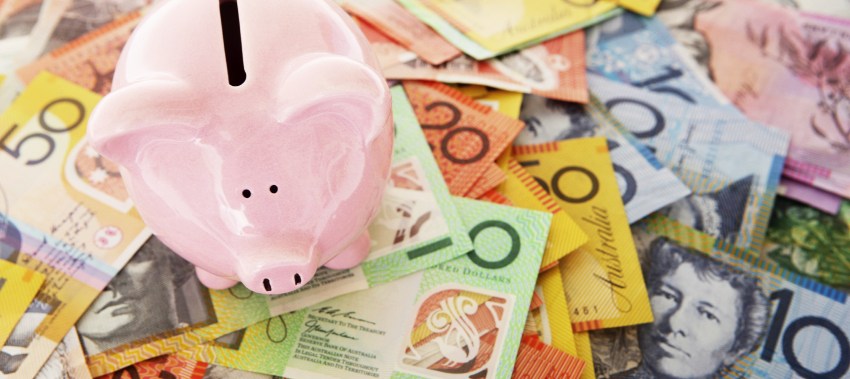 Australian dollars and piggy bank
