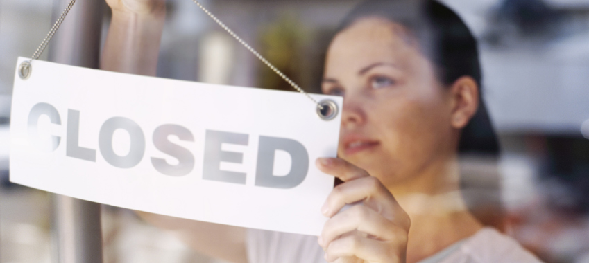 woman with closed sign
